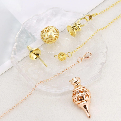Pendule divinatoire bronze doree