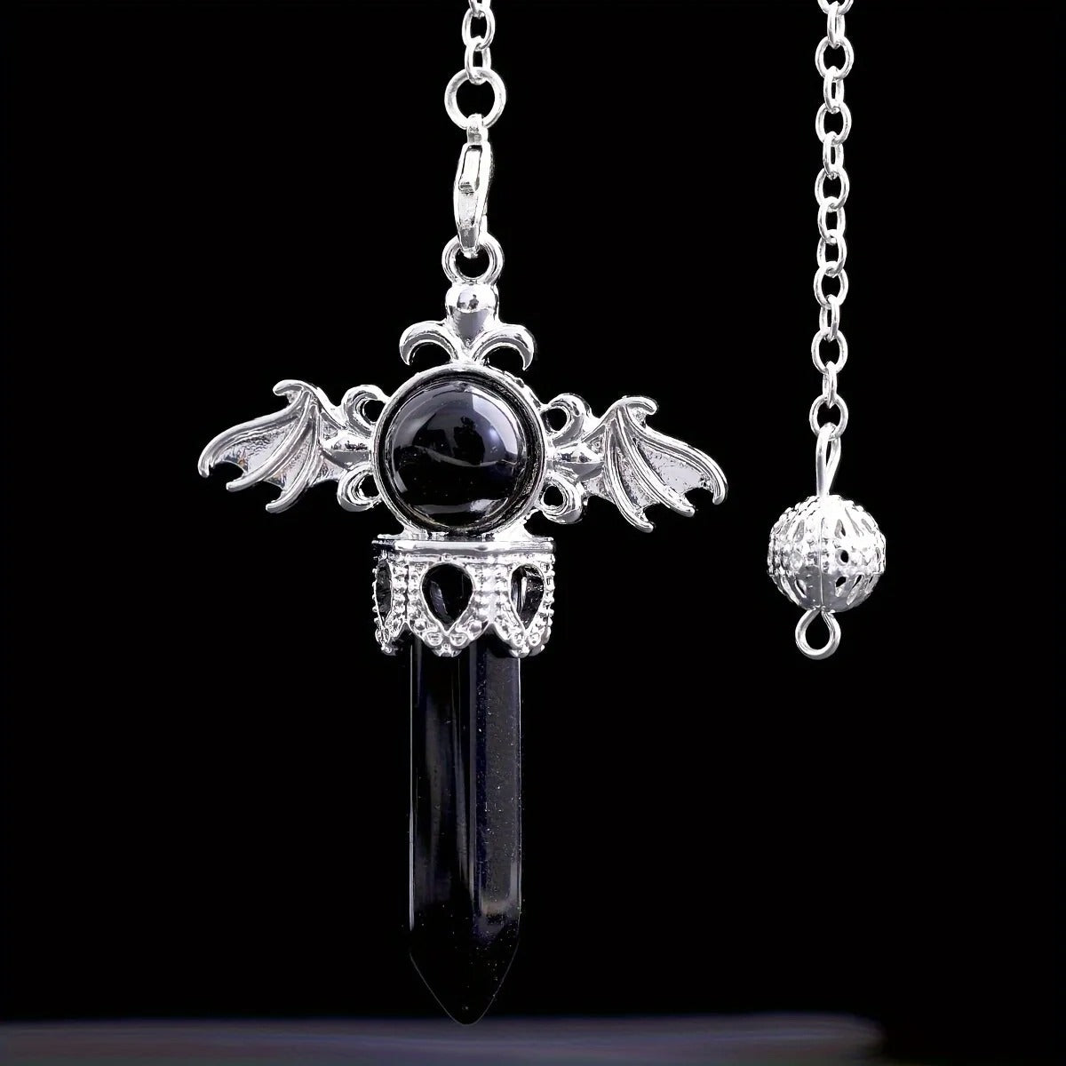 pendule oui non aile d'ange noir