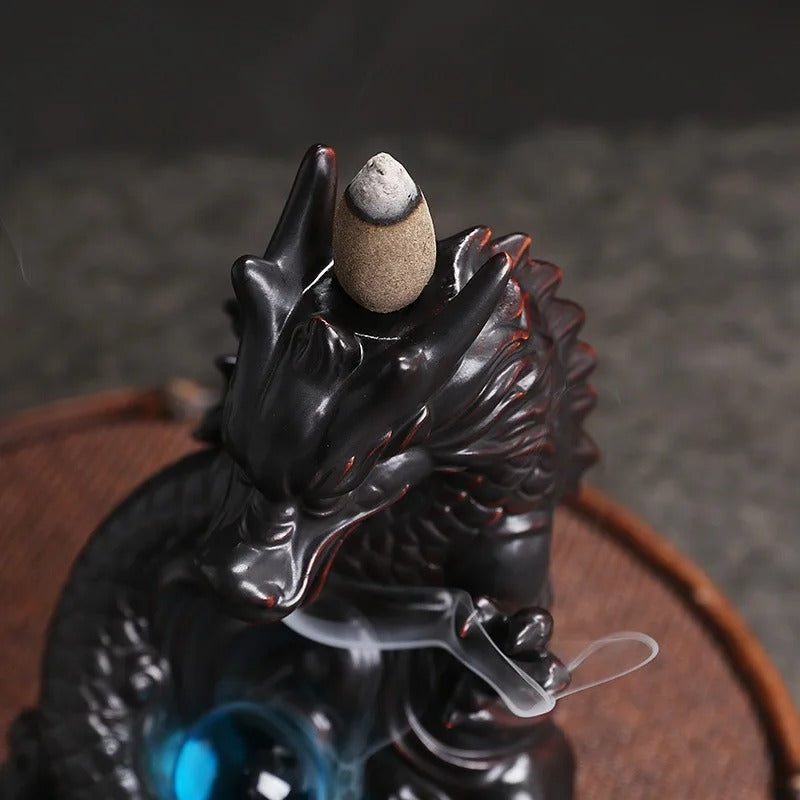 porte encens statue dragon dessus