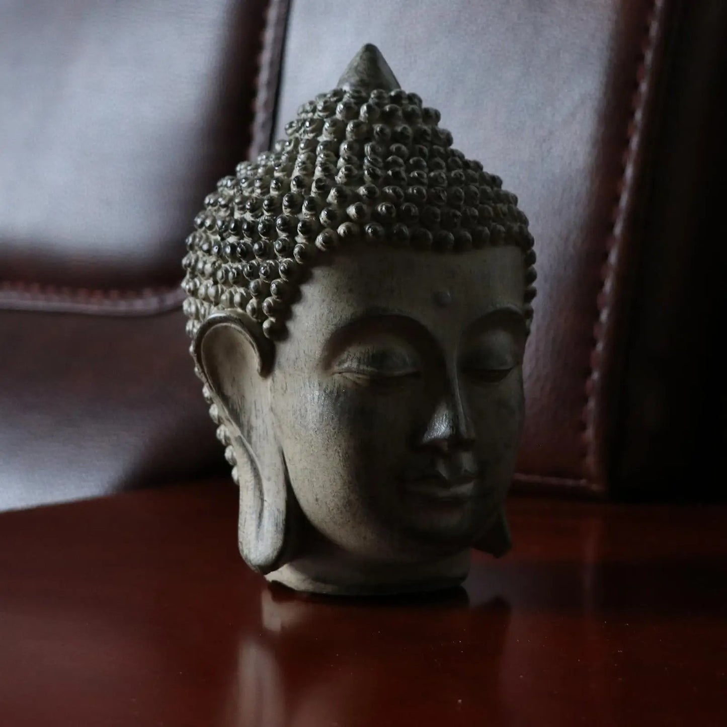 statue tete bouddha profil